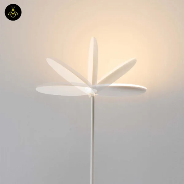 White LED floor lamp with adjustable head adding warm light in a bedroom