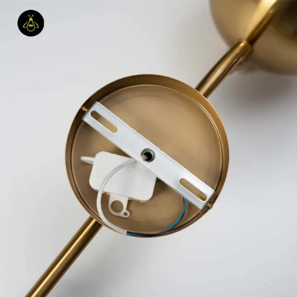 Opal white light backplate opened, showing the mounting bar and wiring connector inside