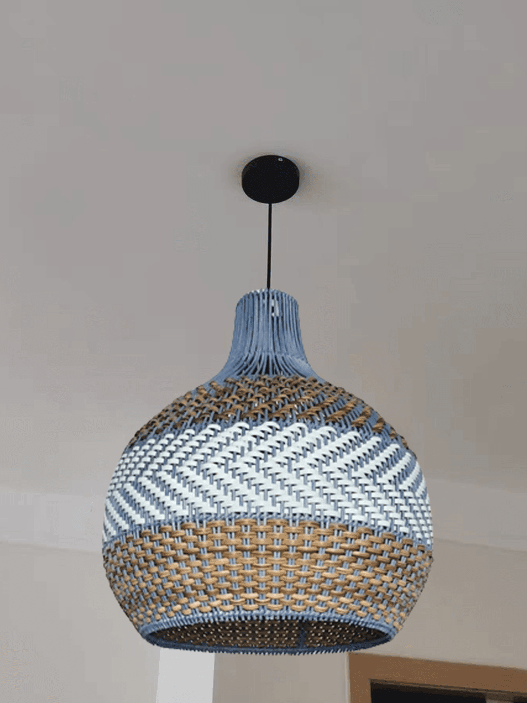 Rattan Hanging Lamp – Handwoven Coastal Pendant, 40 cm 2 Rattan hanging lamp installed with black cord and ceiling canopy indoors – Jagmag Lights