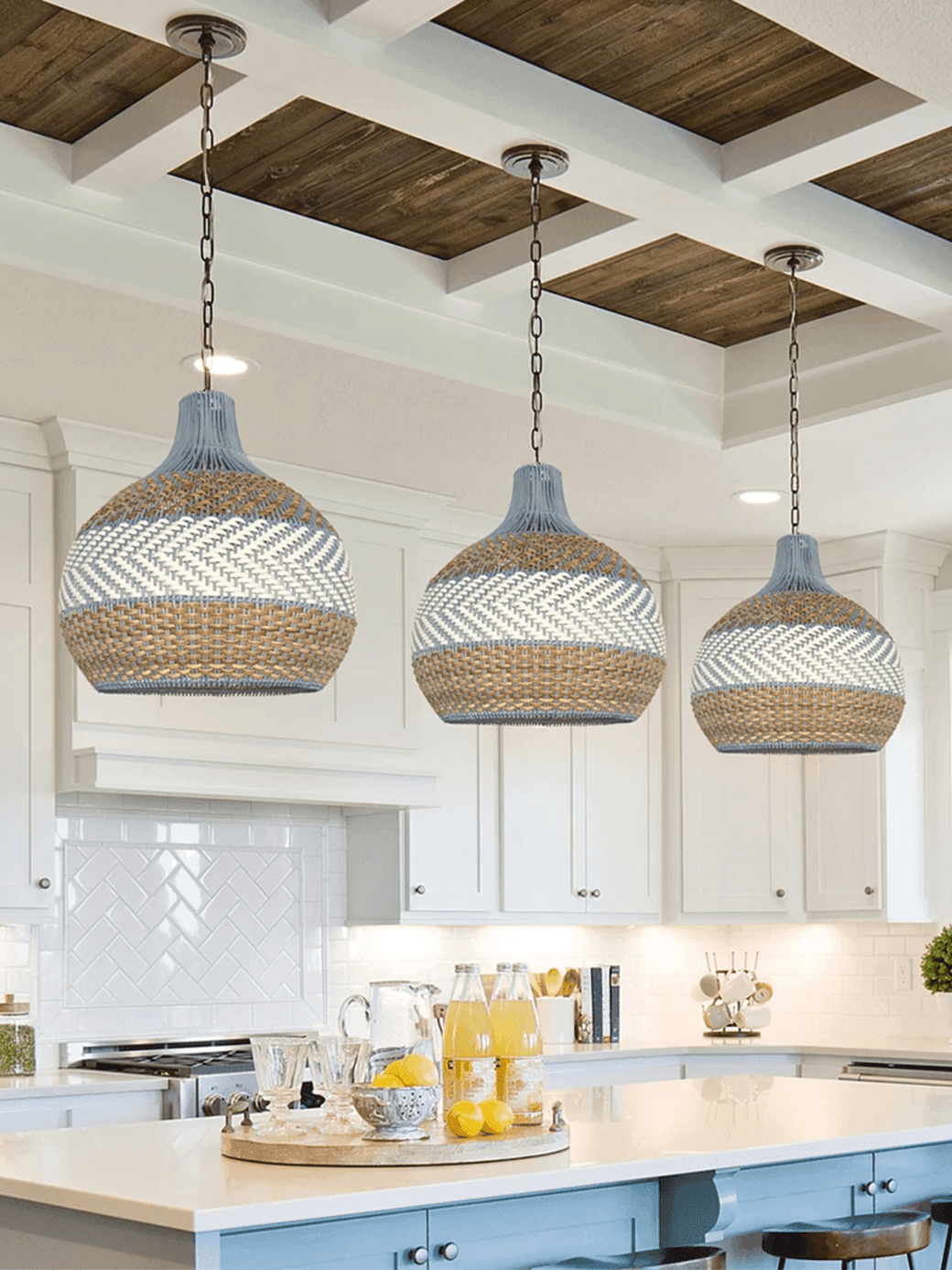 Rattan Hanging Lamp – Handwoven Coastal Pendant, 40 cm 3 Three rattan pendant lights in a row over a white coastal kitchen island – Jagmag Lights