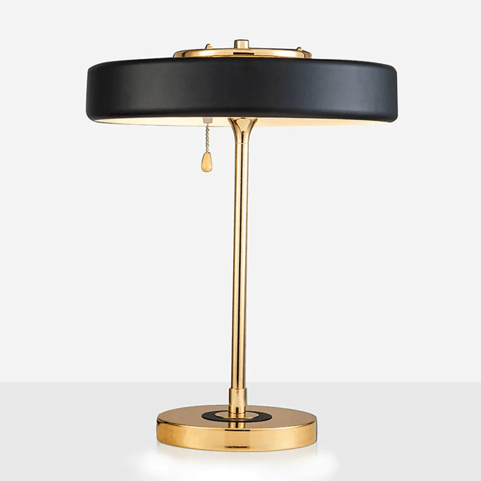 Retro study lamp with a matte black steel disc shade, polished gold stem, pull chain and round gold base