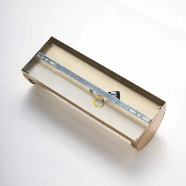 Back of the ribbed glass wall light showing the steel mounting bracket inside the brushed gold backplate