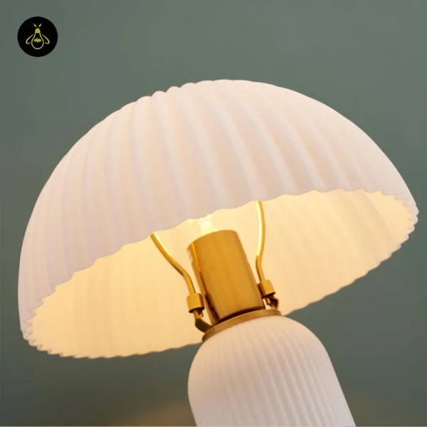 Pleated opal-glass dome shade and E27 socket of the mushroom table lamp