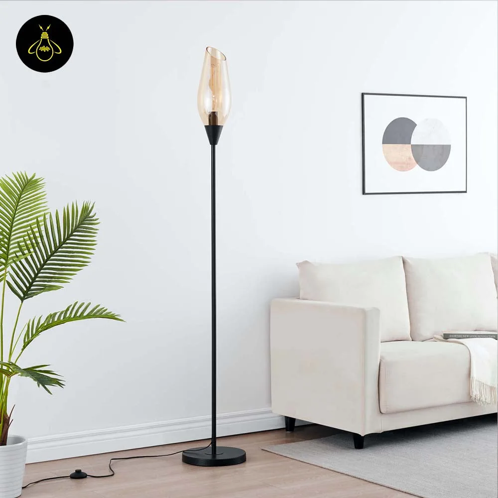 Black Amber Glass Floor Lamp – Modern Teardrop Shade | Ambrosia 7 Detail of the round black base and slim pole of the amber glass floor lamp