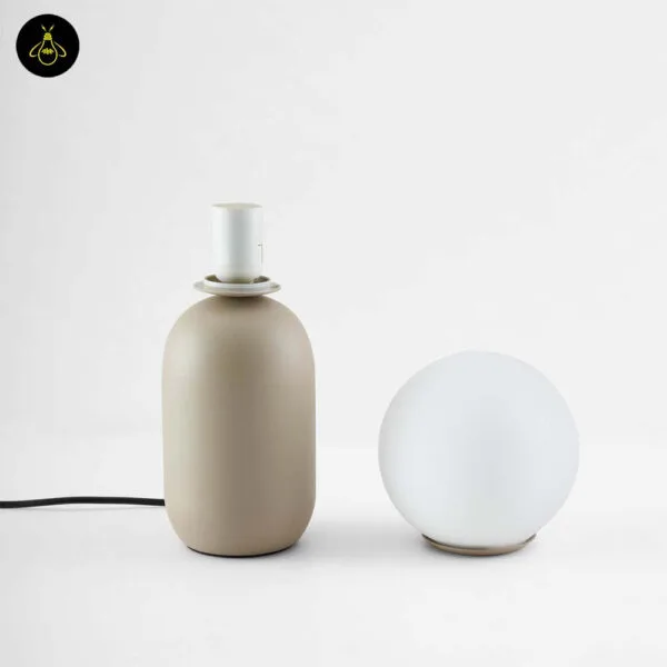 Taupe steel base and removable white opal globe of the table lamp