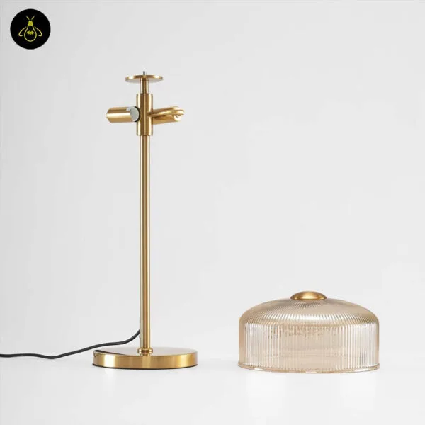 Ribbed amber glass table lamp on a study table