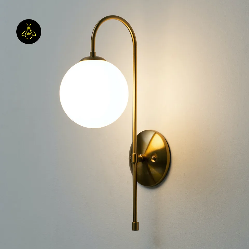 Oriol Frosted Glass Globe Wall Sconce – 48 cm Antique Gold Arch | Jagmag Lights 11 Vintage-gold finish detail of the gold living room wall light with opal borosilicate glass