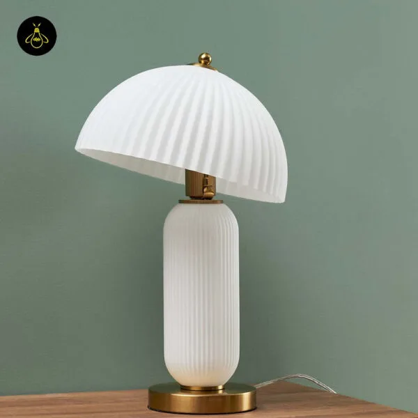White fluted glass mushroom table lamp styled for hospitality interiors