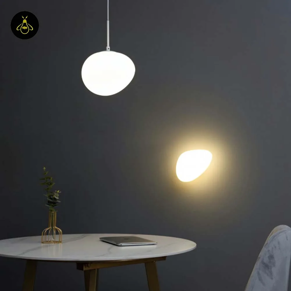 White Opaline Wall Light – Veglia 25 cm Glass Disc 15 White LED wall light mounted beside a bed for soft bedside lighting