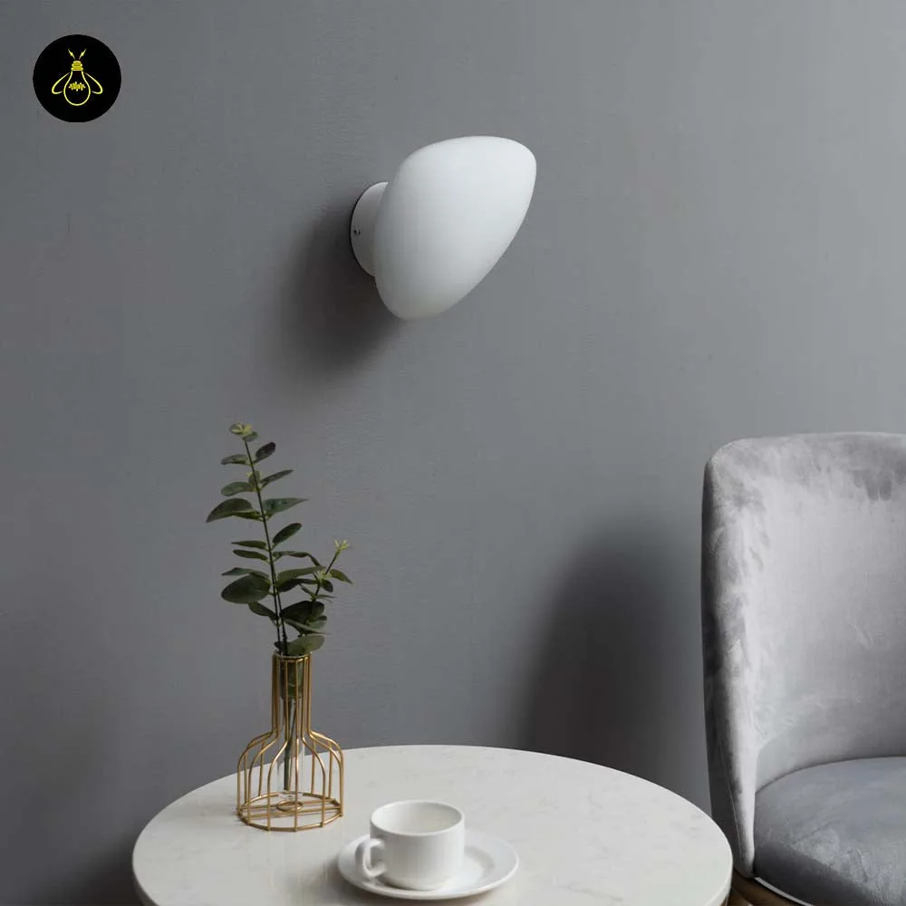 White Opaline Wall Light – Veglia 25 cm Glass Disc 10 White LED wall light with a soft opaline glow along a hallway wall