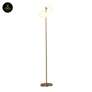 Gold glass globe floor lamp with three white opal spheres on a plain white background