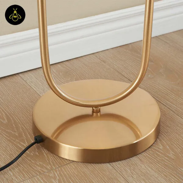 Opal borosilicate glass globes on a brass floor lamp