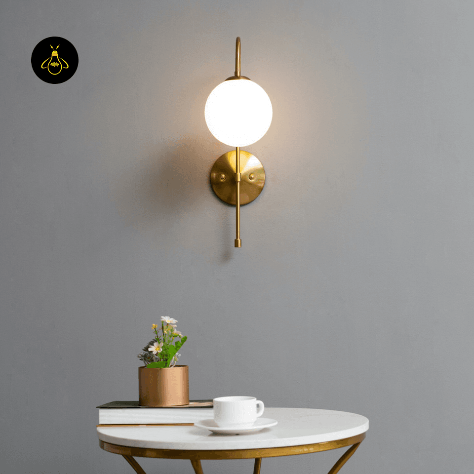 Gold Wall Light for Living Room – Oriol 48 cm Globe Sconce 13 Frosted glass globe and gold metal cap close-up of the living room wall light