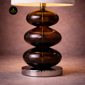 Close-up of Adam bedside lamp stacked glass body and metal plinth