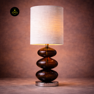Compact amber brown glass bedside lamp with stacked rounded form