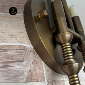 Modern wall sconce angled installation view with alabaster dome shade and brass finish