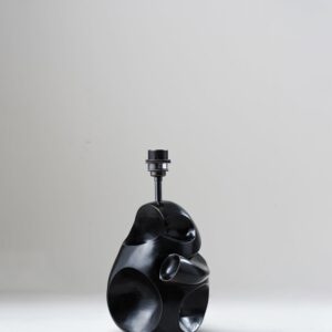Asymmetrical table lamp base view without shade showing sculptural form