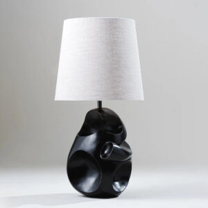 Asymmetrical table lamp front view with linen shade