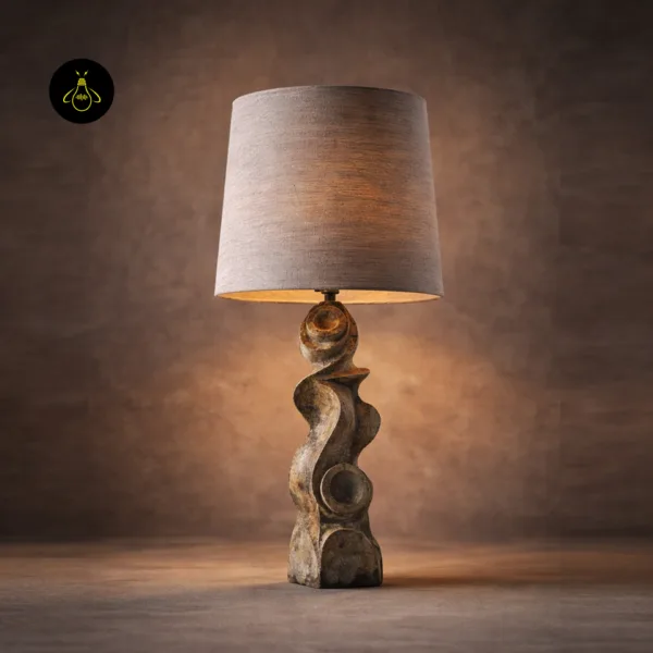 Designer sculptural table lamp hero view with warm ambient light