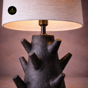 Close-up of rustic table lamp fabric shade and dark wood branch base