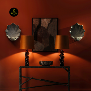 Pair of Lucian wooden table lamps styled on a console in a warm interior