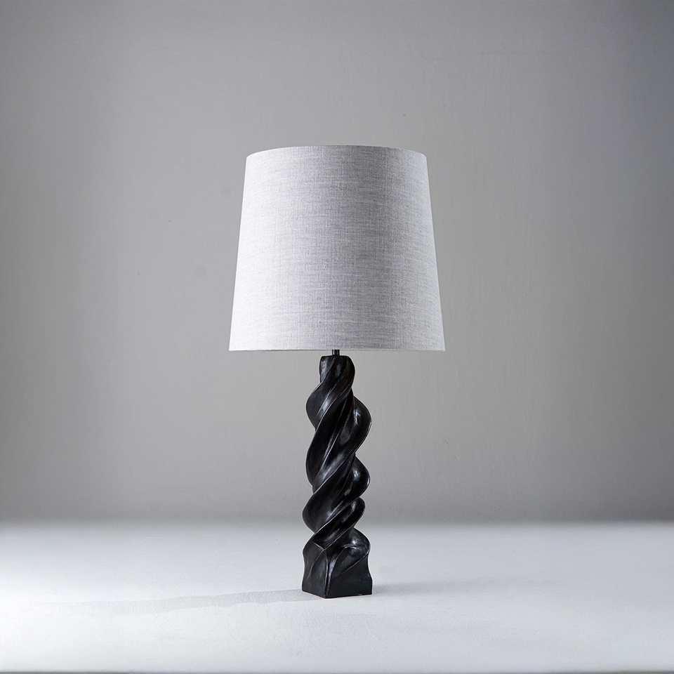 Twisted table lamp with carved spiral wood base and linen shade