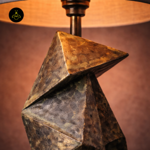 Close-up of origami wooden table lamp upper folded base detail