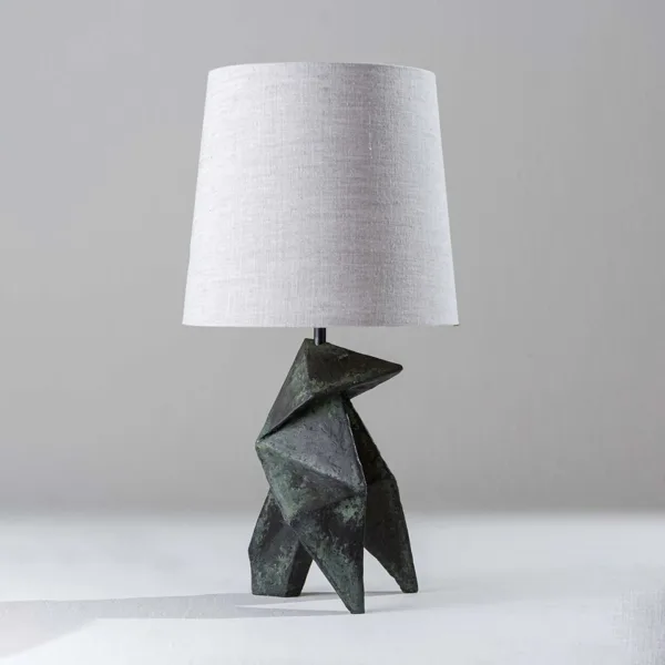 Geometric table lamp with linen shade and dark bronze-verdigris origami wood base