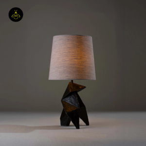 Origami wooden table lamp lit with warm ambient glow