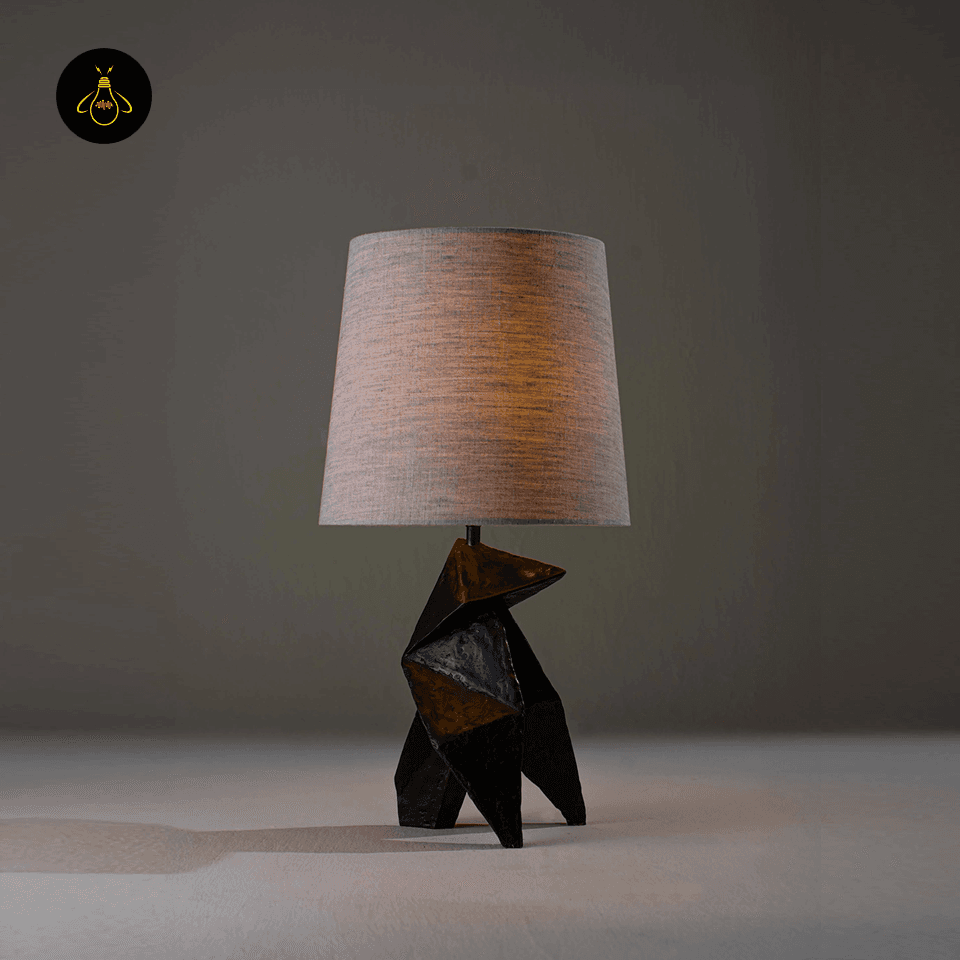 Geometric Table Lamp – Origami Folded Wood Base, 54 cm 3 Geometric origami table lamp lit with warm ambient glow through linen shade