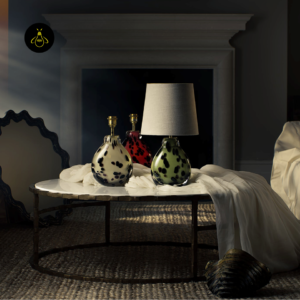 Small table lamp shown with related coloured glass versions in a styled interior