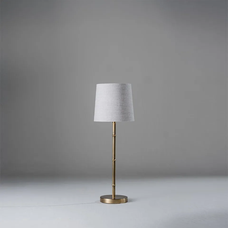 Mini Brass Table Lamp – Slim Bamboo-Stem Design, 53 cm 1 Mini brass table lamp with a slim bamboo-style stem and grey-linen shade for a narrow nightstand