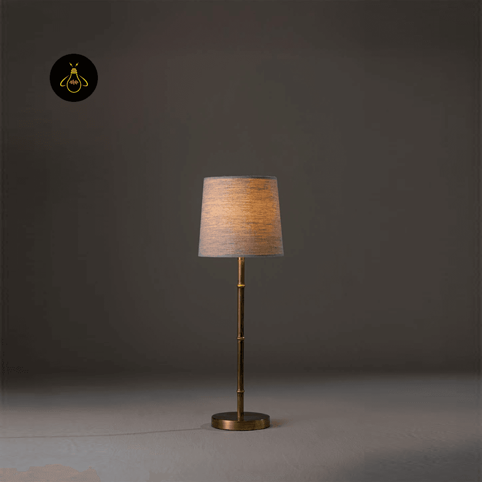 Mini Brass Table Lamp – Slim Bamboo-Stem Design, 53 cm 6 Mini brass table lamp in a studio shot with the linen shade softly illuminated