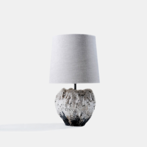 Designer table lamp with textured wood base and fabric shade
