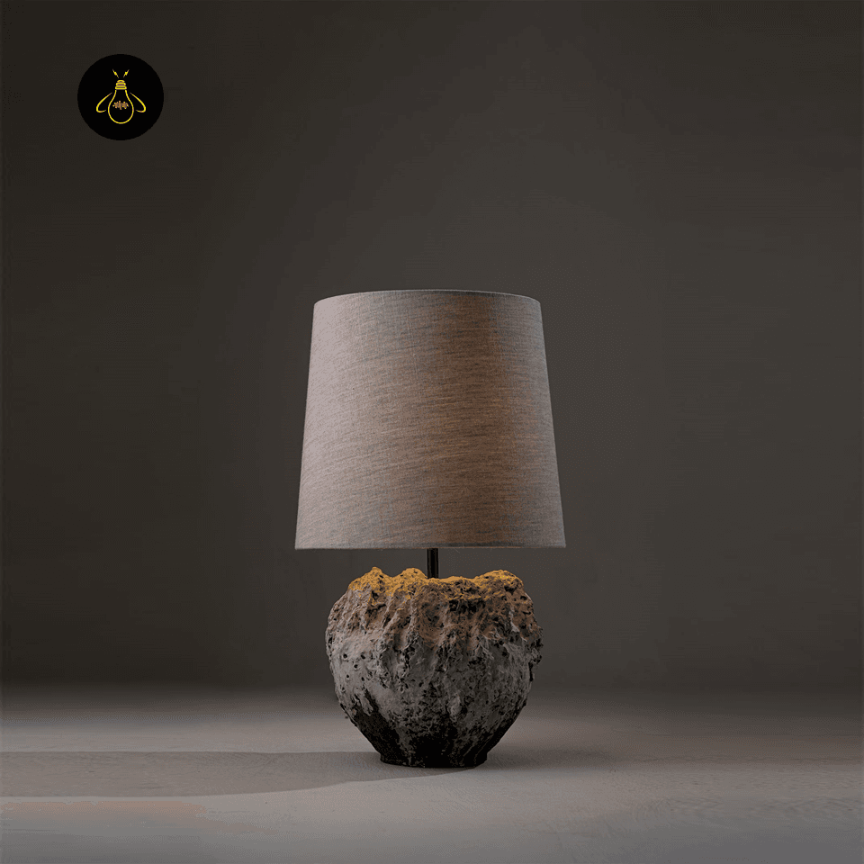 Wabi Sabi Table Lamp – Vela Sculptural Textured 55 cm 2 Wabi sabi table lamp lit, casting a warm diffused glow through its linen shade