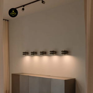 Modern wall light installed in a row on a feature wall to show repeated ambient effect