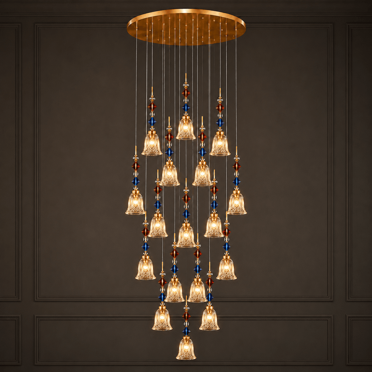 18-light crystal foyer chandelier lit against dark panel wall — K9 glass bell cascade with blue and red crystal beads – Jagmag Lights