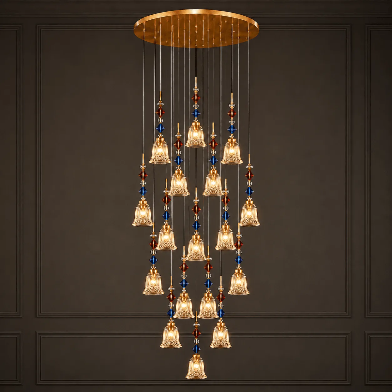 18-light crystal foyer chandelier lit against dark panel wall — K9 glass bell cascade with blue and red crystal beads – Jagmag Lights
