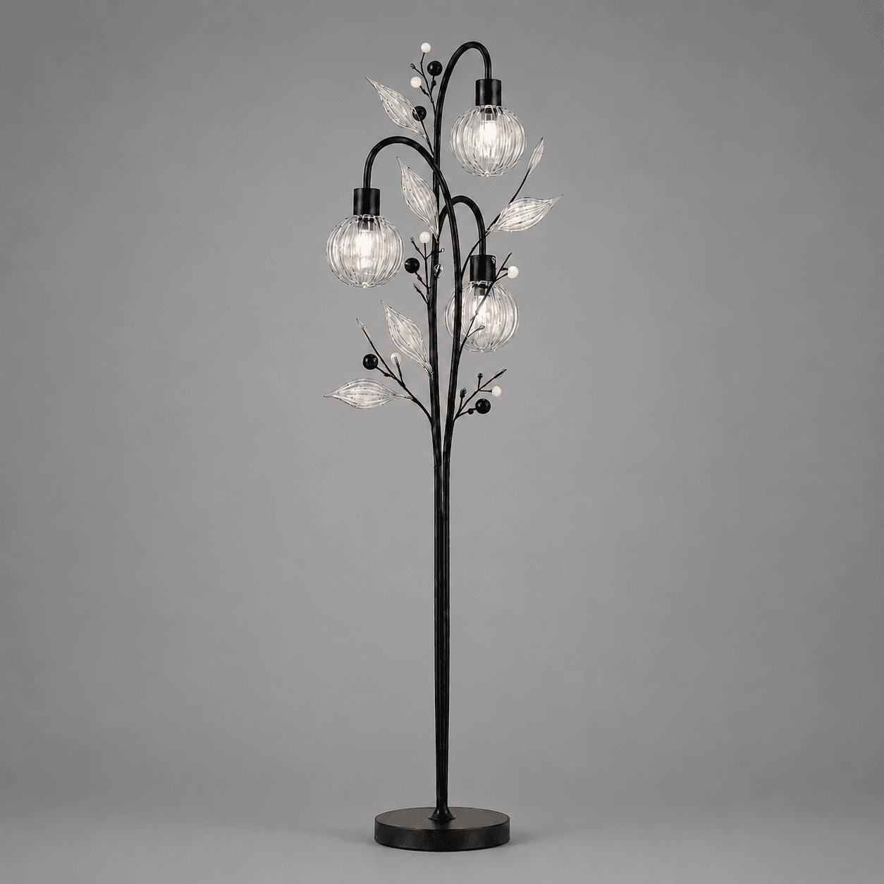 Crystal Berry Botanical Floor Lamp — 3-Light Ribbed Glass Globe & Leaf Tree 2 Crystal berry botanical floor lamp on grey background lit — black metal tree trunk with three ribbed clear glass globe cage shades, clear ribbed glass leaves and matte black and white pearl bead accents