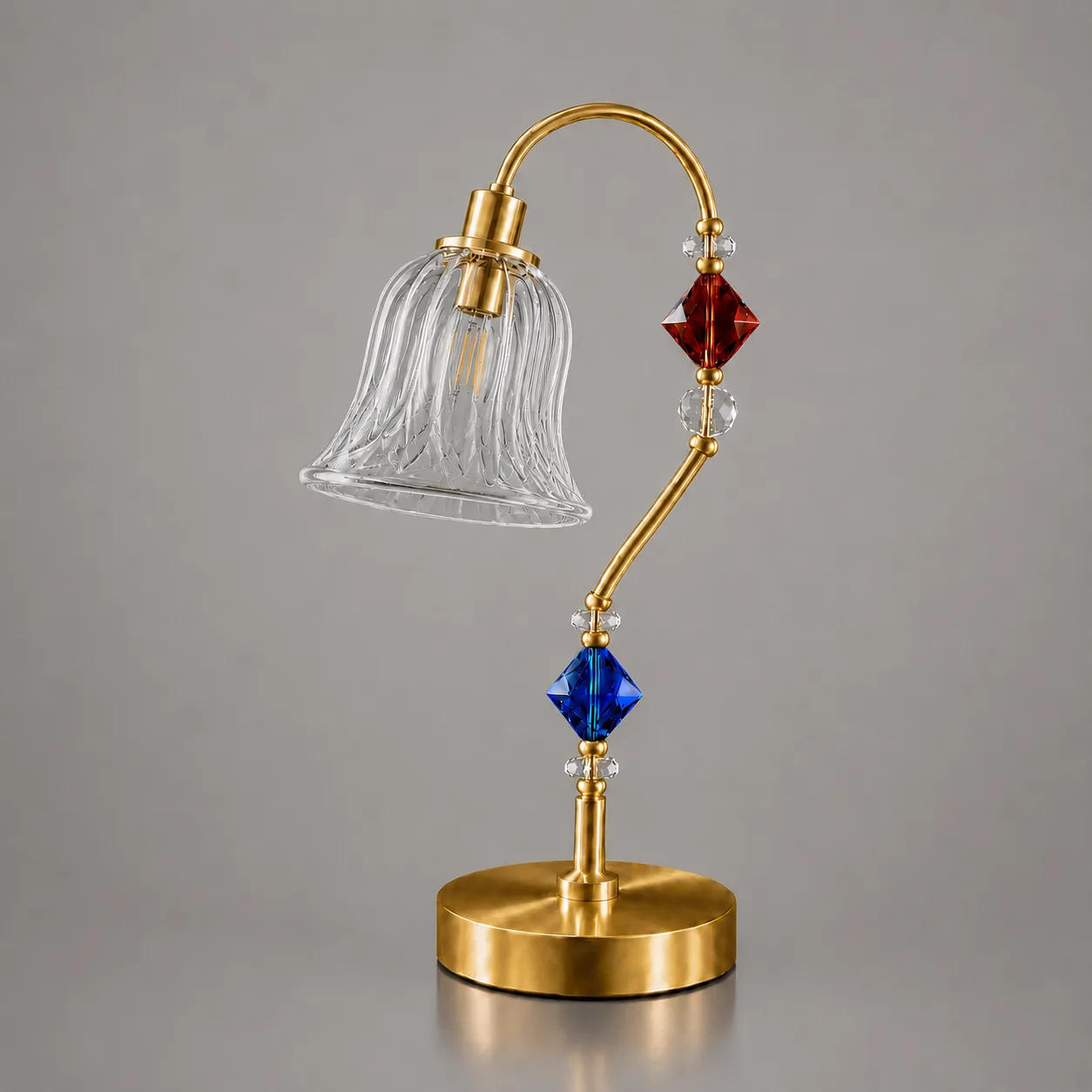 Single Glass Table Lamp — Cut Glass Bell Sconce 3 Single glass table lamp unlit on grey background — clear diagonal-lattice cut-glass bell shade on satin gold arc arm with crystal bead stem