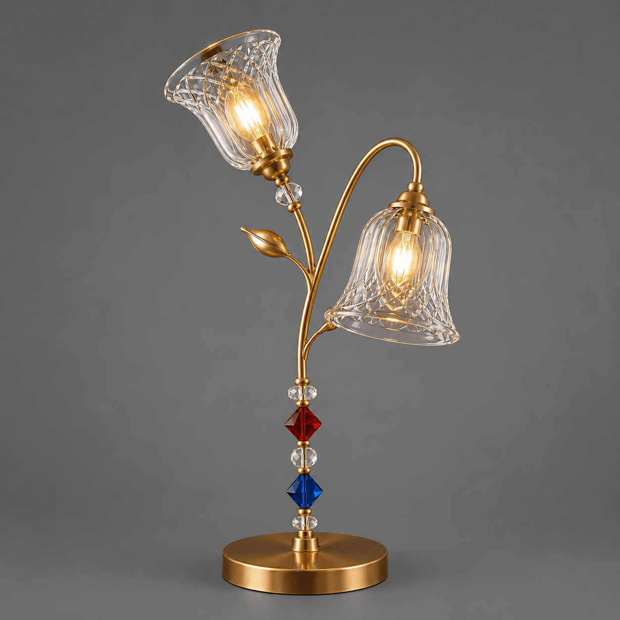 Double Glass Table Lamp – Twin Cut-Glass Bell Sconce with Crystal Bead Stem | Jagmag Lights 4 Double glass table lamp on grey background — satin gold finish, one upward-facing shade and one outward-facing shade on floral stem