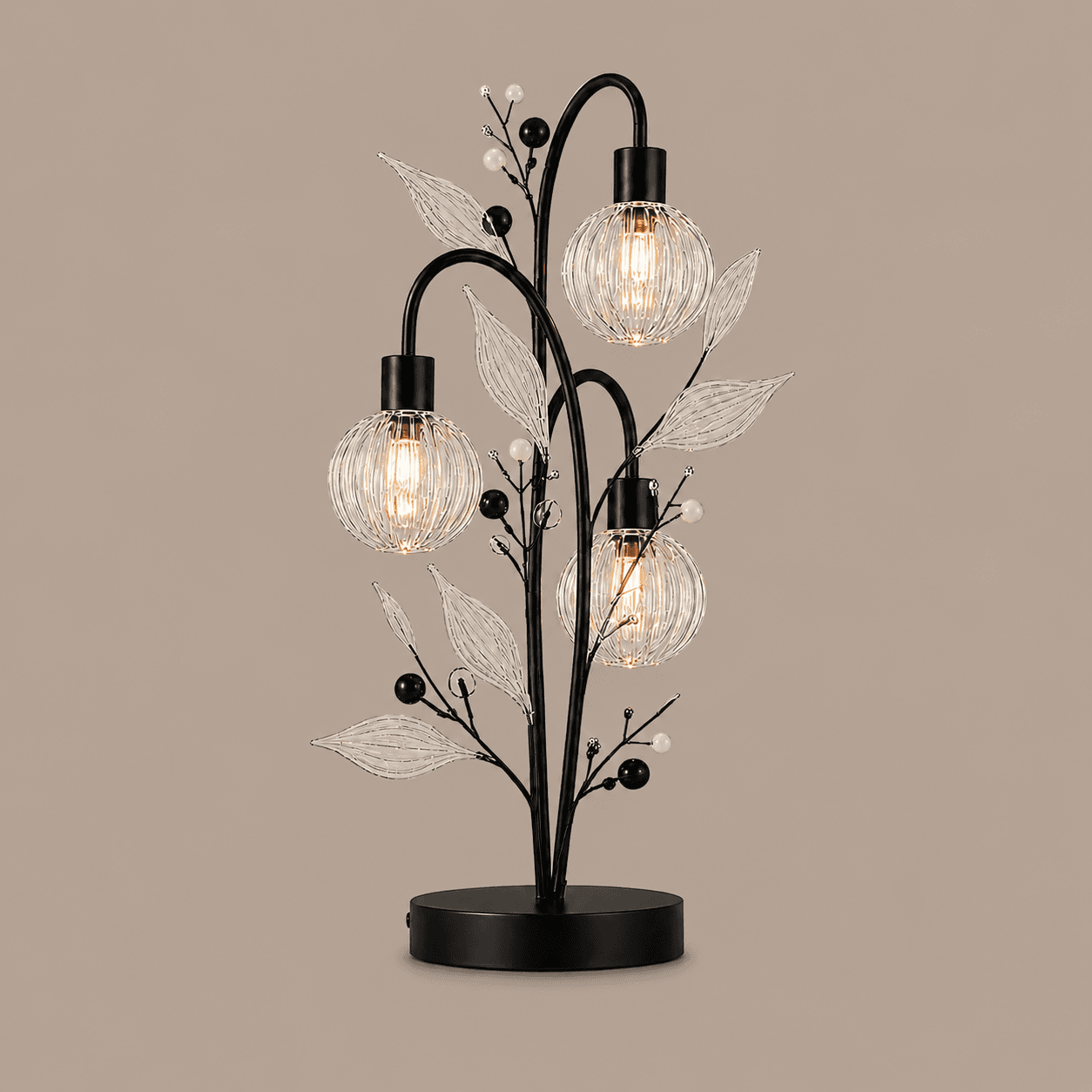 Crystal Berry Botanical Table Lamp — 3-Light Ribbed Glass Globe & Leaf Tree 4 Crystal berry botanical table lamp on warm beige background lit — three ribbed glass globe cage shades on arching black branches with clear glass leaves and pearl berry bead accents