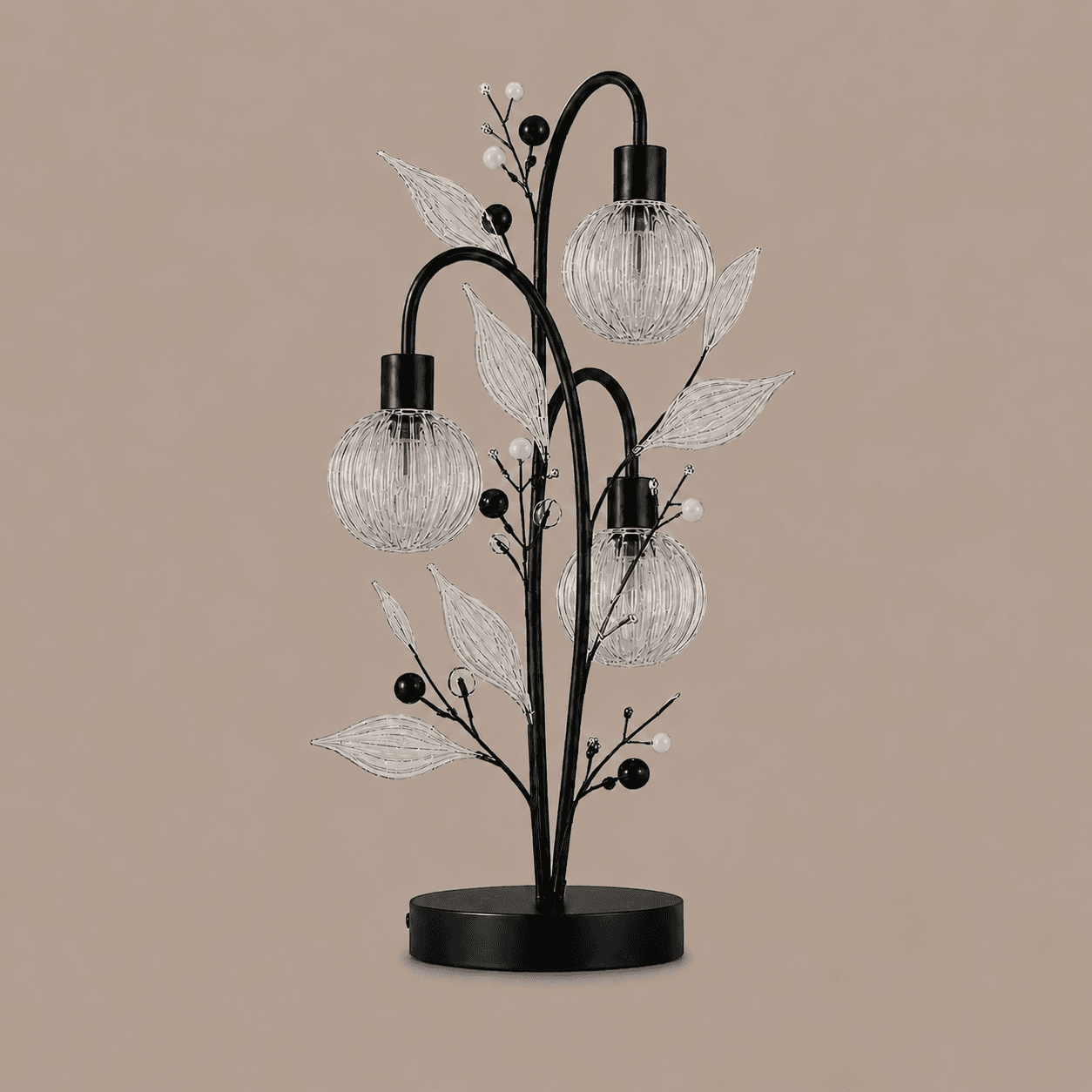 Crystal Berry Botanical Table Lamp — 3-Light Ribbed Glass Globe & Leaf Tree 5 Crystal berry botanical table lamp on warm beige background unlit — black metal tree frame with three ribbed glass globe cages, clear ribbed glass leaves, matte black and white pearl beads