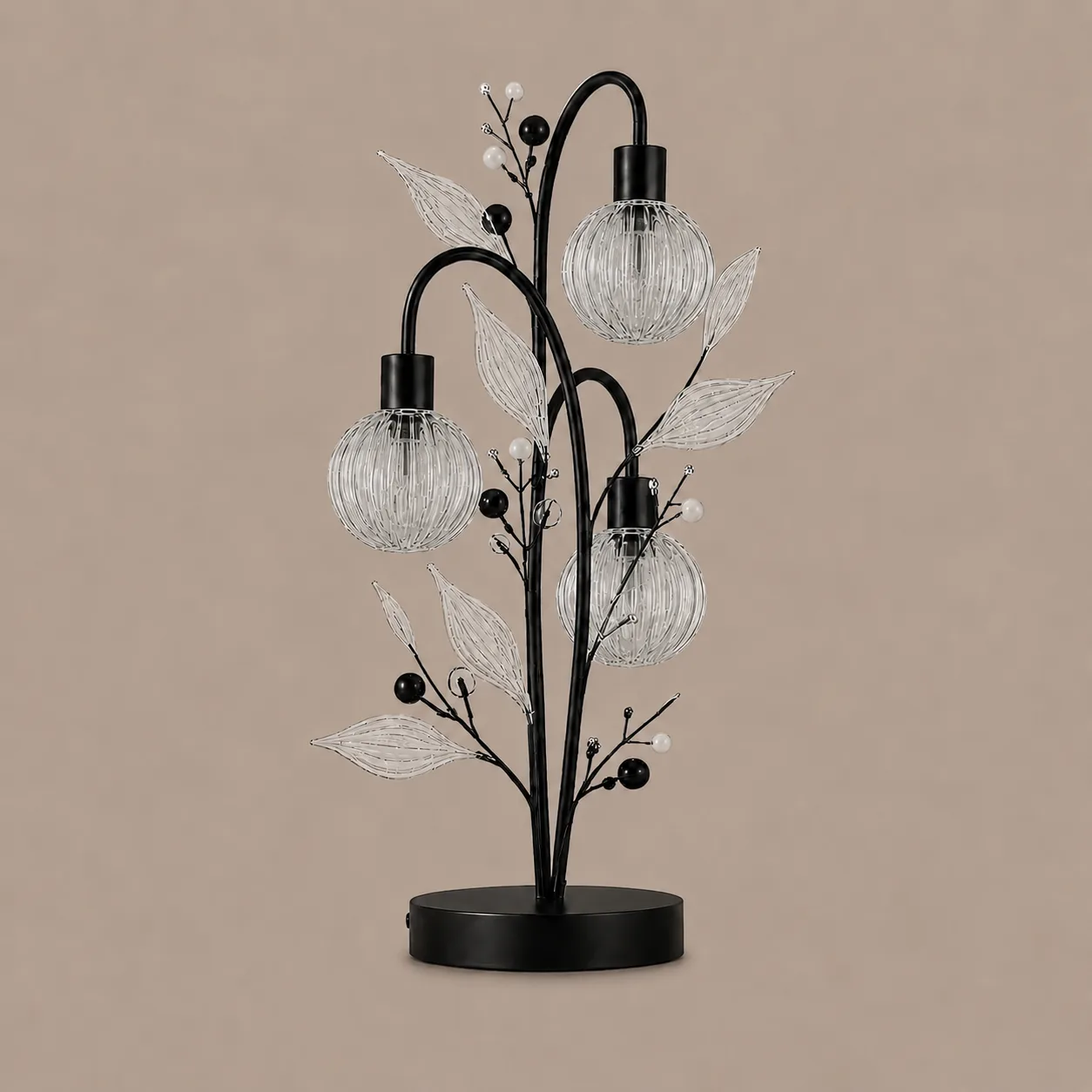 Crystal Berry Botanical Table Lamp— 3-Light Ribbed Glass Globe & Leaf Tree 4 Crystal berry botanical table lamp on warm beige background unlit — black metal tree frame with three ribbed glass globe cages, clear ribbed glass leaves, matte black and white pearl beads