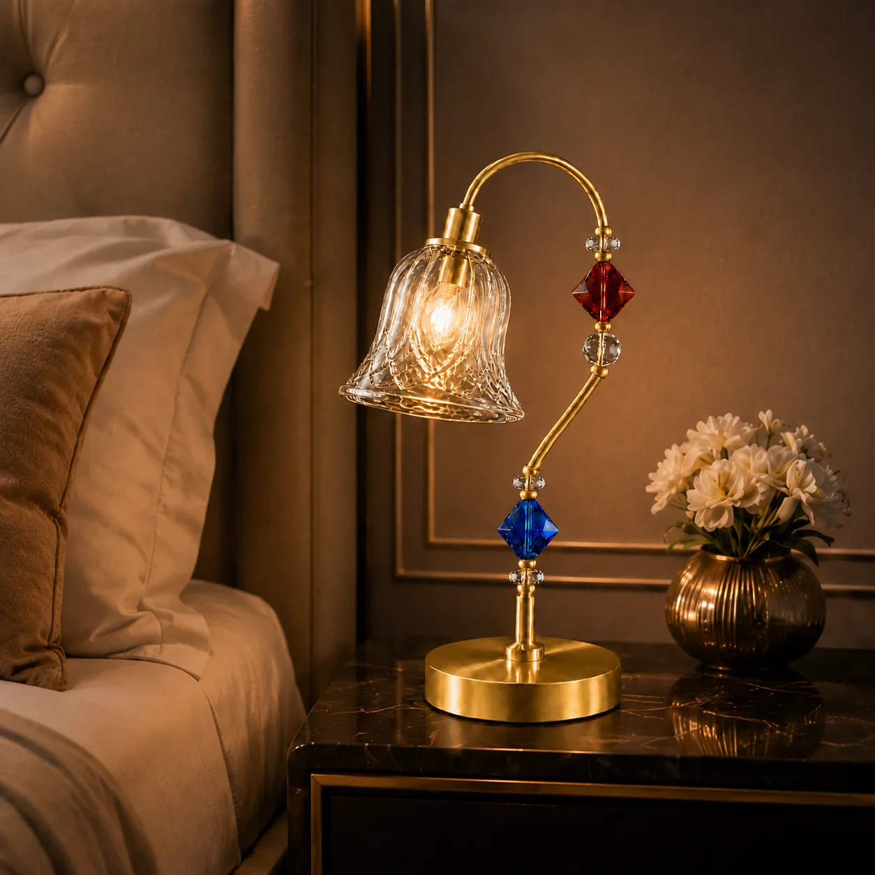 Single Glass Table Lamp — Cut Glass Bell Sconce 6 Single glass table lamp on bedroom bedside table — warm amber glow from cut-glass bell shade, satin gold arc arm and Ø205 mm round base