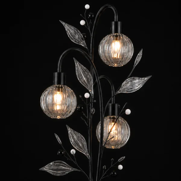 Crystal berry botanical floor lamp close-up detail on black background — ribbed clear borosilicate glass globe cage shades lit with warm E27 filament, clear ribbed glass leaves and matte black and white pearl bead branch sprays