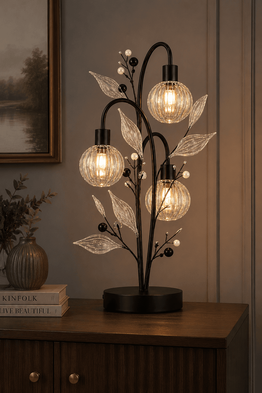 Crystal Berry Botanical Table Lamp — 3-Light Ribbed Glass Globe & Leaf Tree 7 Crystal berry botanical table lamp on living room sideboard — three ribbed glass globes glowing warm amber on black branch tree, warm paneled wall setting with books and ribbed vase