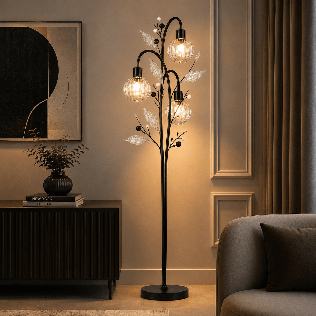 Crystal berry botanical floor lamp in matte black metal with warm amber glow in living room corner — Jagmag Lights