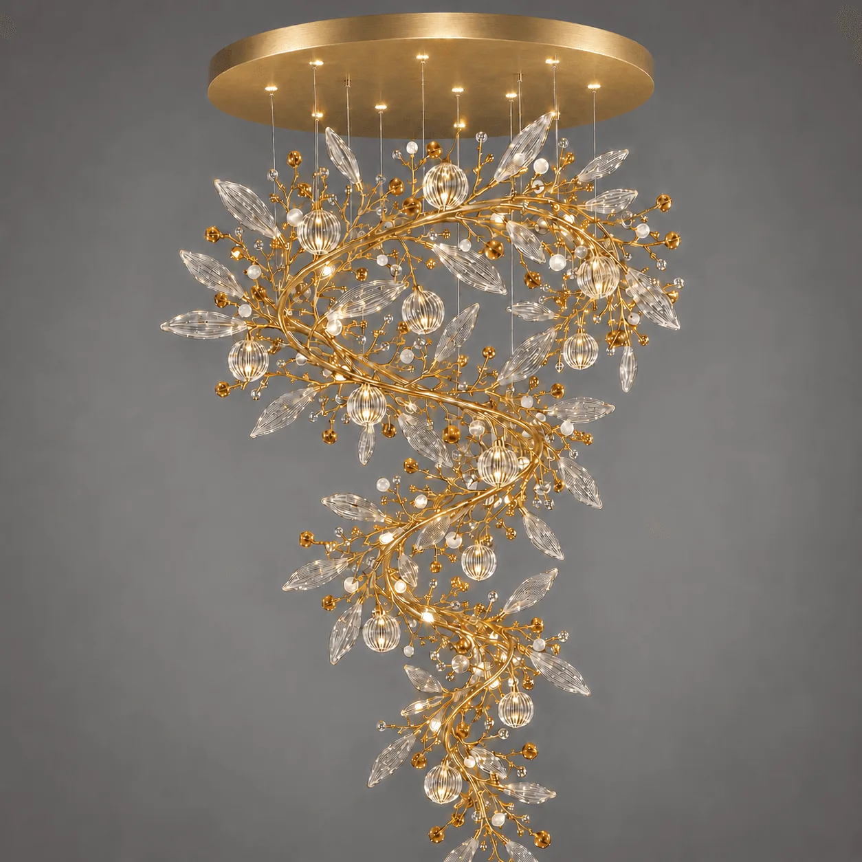 The Crystal Vine — A Sculptural Cascade of Light 4 Crystal vine foyer chandelier close-up on grey background — satin gold branches with marquise crystal leaves, pearl-white beads and lit ribbed globe pendants