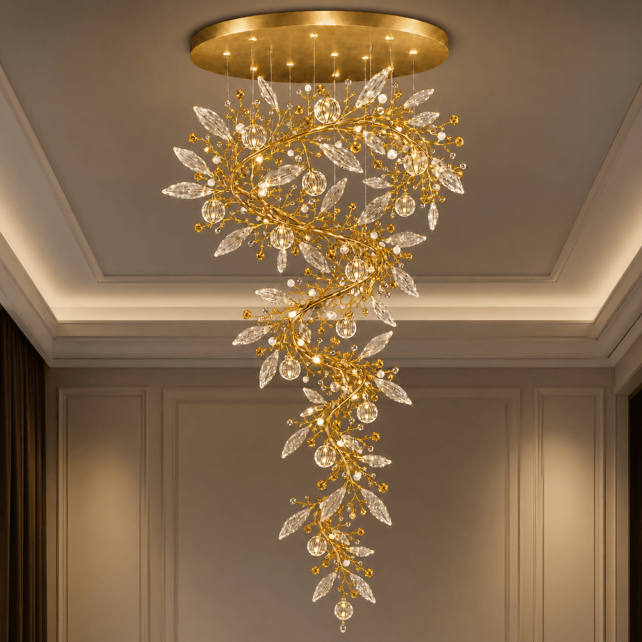Crystal vine foyer chandelier in grand corridor — satin gold spiral branch with marquise crystal leaves and globe pendants, warm filament glow — JagMag Lights JML-414